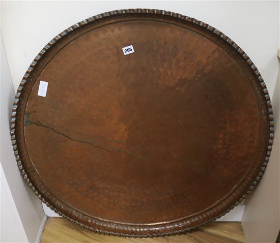 A large hammered copper tray